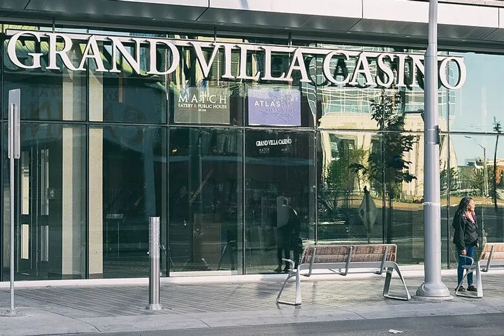 Street entrance of Grand Villa Casino Edmonton, with the casino name over the glass doors